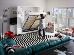 woman closing murphy bed