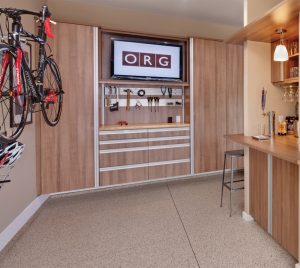 brown wood garage storage with tv and bike